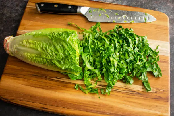 chopping vegetables using a santoku knife