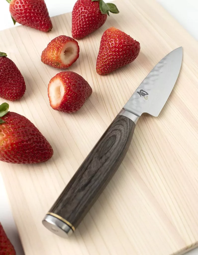 coring strawberries with a paring knife 653785467e8a6