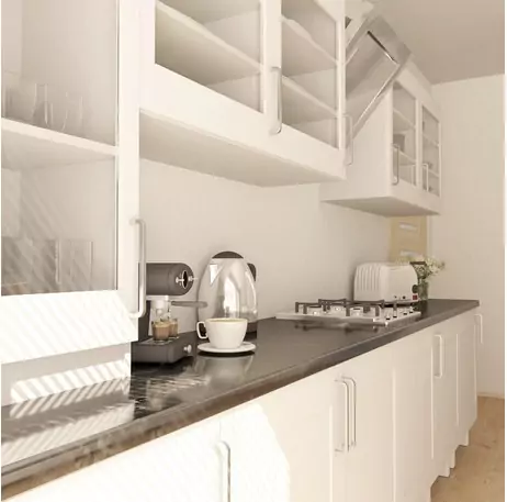 a very close look of a kitchen with countertop appliances like kettle, oven and coffee machine