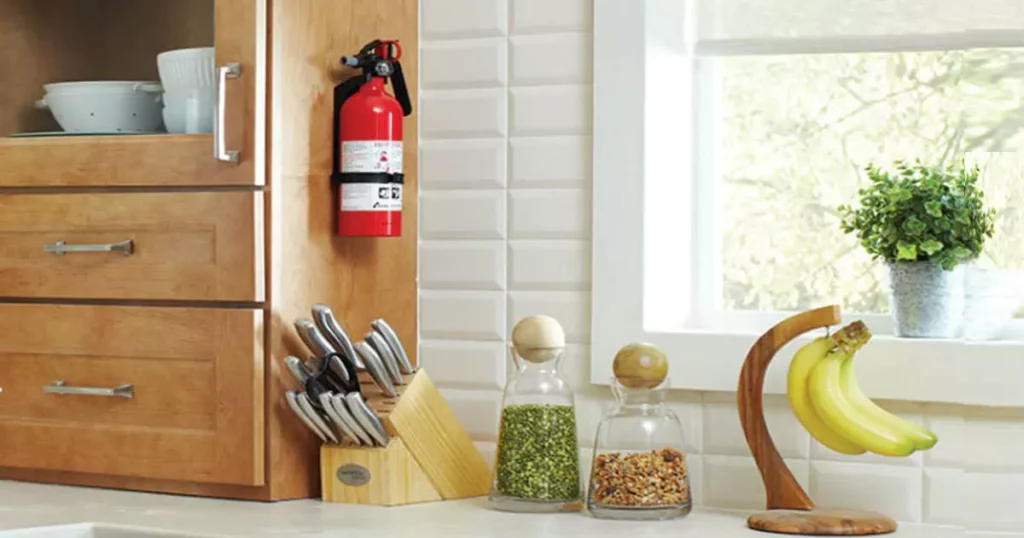 a small fire extinguisher installed on the kitchen wall. 