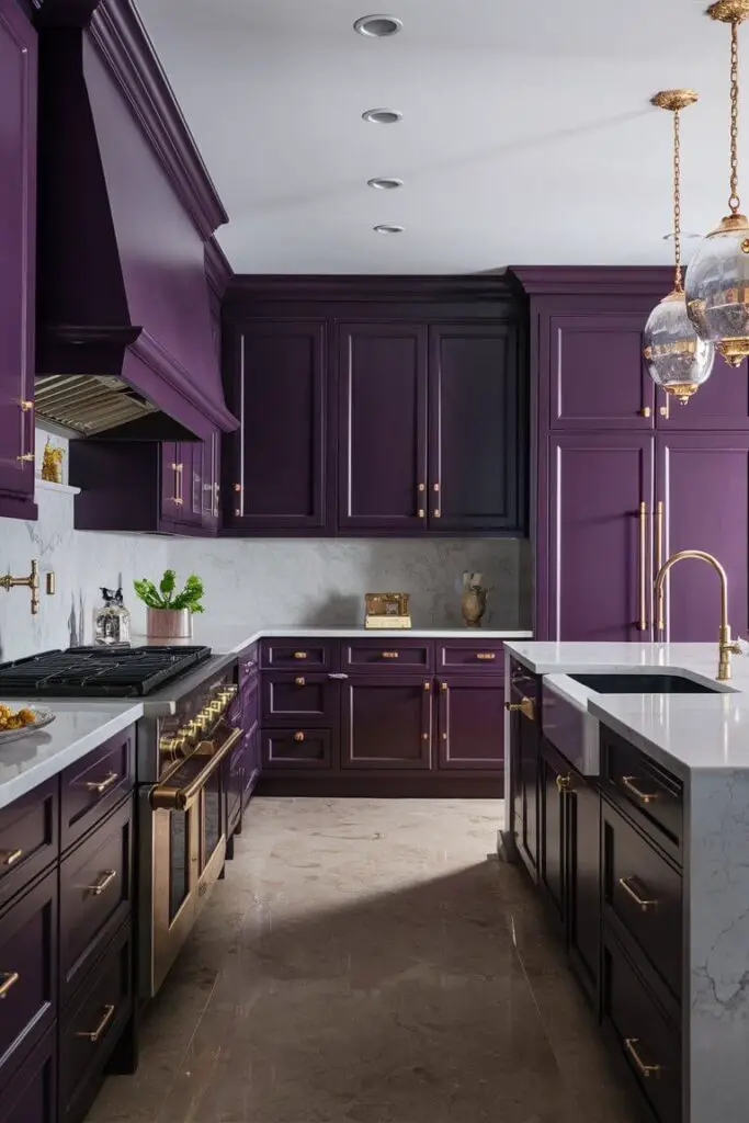 A regal kitchen featuring a deep purple and gold color combination. Deep purple cabinetry is accented with gold hardware and fixtures, paired with a white marble backsplash and countertops for a luxurious finish.