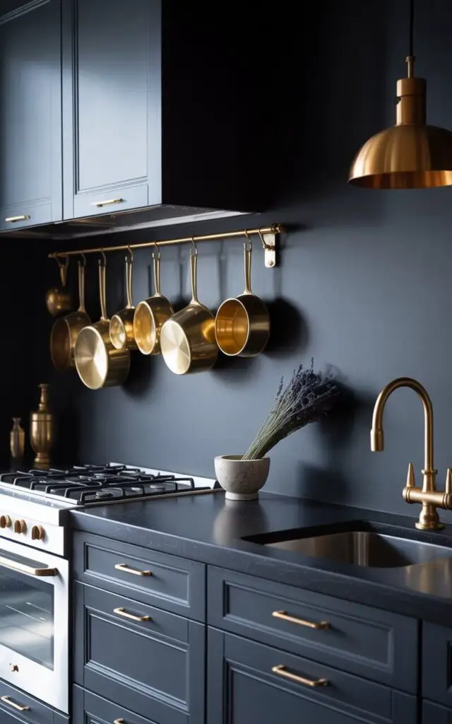 A photograph of a pristine, minimalist witchy kitchen bathed in soft, diffused light. The kitchen features sleek matte black cabinets accented with polished golden handles, centered around a black countertop illuminated by a single, elegant gold lampshade. Above the gas stove, a collection of gleaming golden pots and pans hangs artfully, reflecting the subtle golden tint of the backsplash, while a brushed gold faucet graces a modern kitchen sink. A single sprig of dried lavender rests on the countertop next to a ceramic mortar and pestle, lending a touch of rustic charm to the otherwise opulent space.