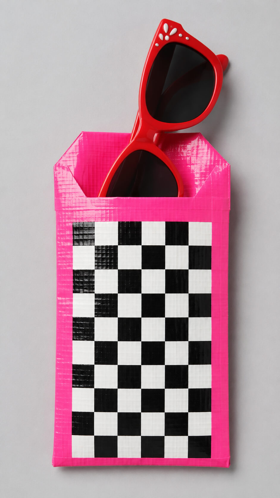 Bright pink sunglasses pouch and eyewear
