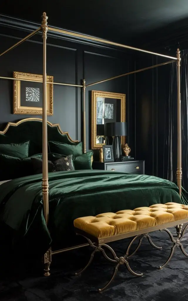 A dark bedroom with matte black walls and shimmering gold accents. There is a cozy bed with deep emerald green bedding and a gold-framed headboard. Matching gold bedside lamps and picture frames add sparkle, while a golden velvet bench at the foot of the bed ties the look together. A dark wood dresser and black curtains complete the sophisticated design.