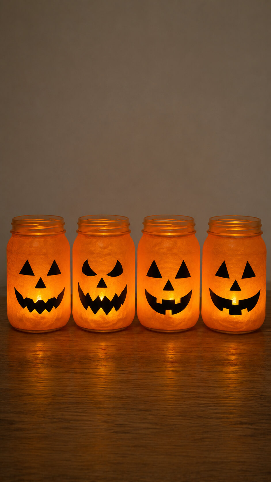 Glowing Jack o Lantern Mason Jar Row
