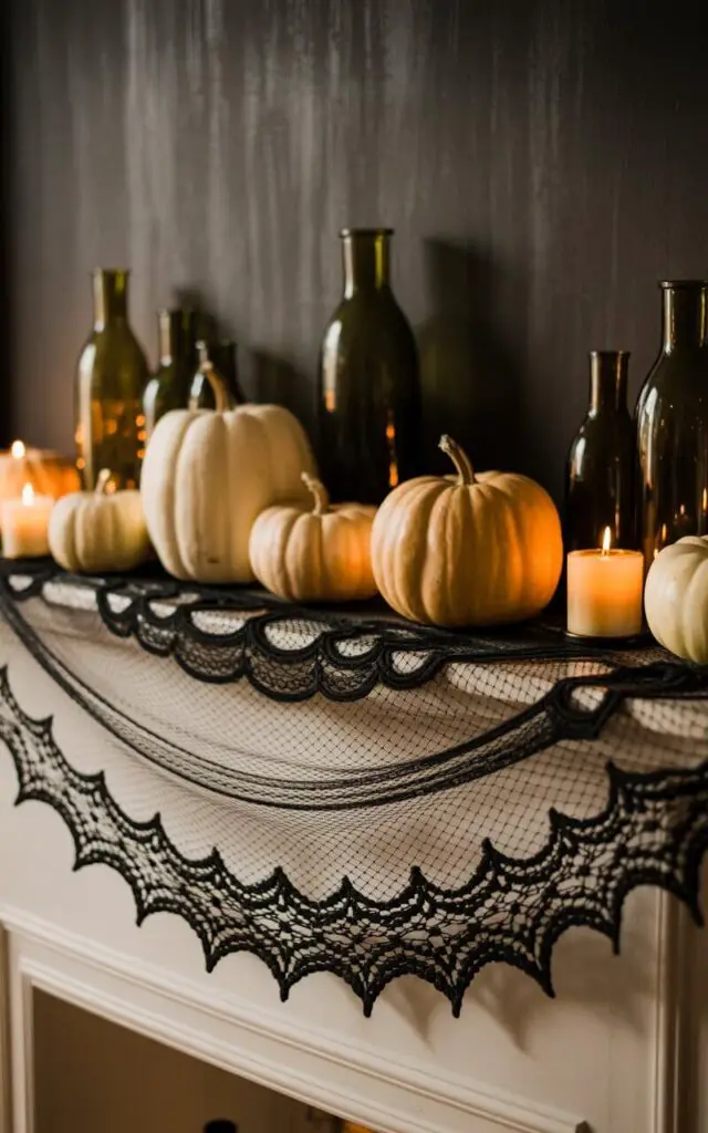 A photograph of a meticulously styled Halloween mantelpiece showcasing an elegant, darkly romantic aesthetic. A black lace runner gracefully cascades across the mantel, resembling a delicate spiderweb, and framing a collection of white pumpkins in varying sizes. Scattered amongst the pumpkins are antique green glass bottles and softly flickering amber candles, casting warm shadows across the textured surfaces. The scene is set against a backdrop of a dark, subtly textured wall, contributing to the overall atmosphere of sophisticated spookiness.