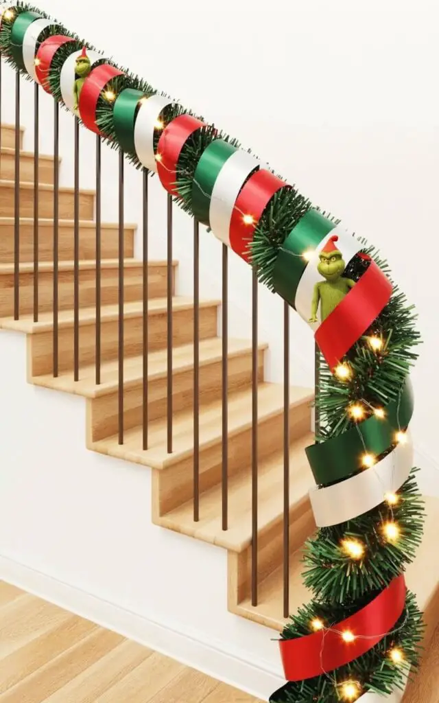 A staircase with smooth white spindles and light wood steps is wrapped in a wide garland made of curly ribbons in alternating shades of bright red, forest green, and crisp white. The ribbons spiral along the metal railing, forming a playful, repeating pattern with small sections of the railing visible between the ribbon coils. Several miniature Grinch figurines with green fur and mischievous expressions are subtly tucked within the twists of the ribbon garland. Warm white string lights are woven throughout the ribbons, emitting a gentle glow that illuminates the garland and casts soft shadows on the surrounding walls.